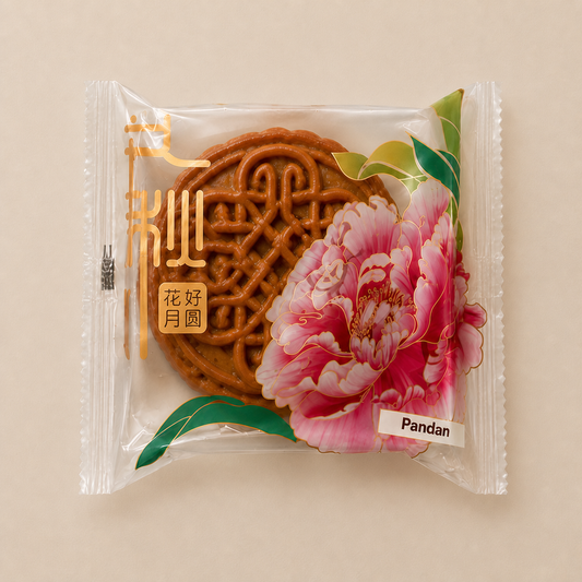 Homemade Malaysian pandan mooncake in Mid-Autumn packaging